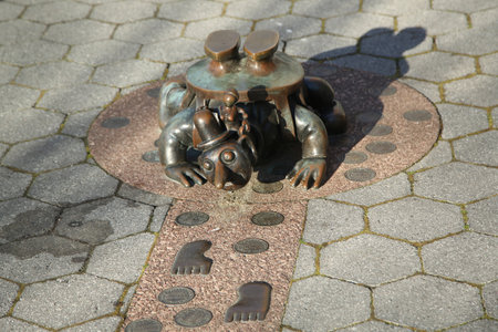 NEW YORK - APRIL 17, 2016: Bronze sculptures at permanent public artwork The Real World created by American sculptor Tom Otterness located in Rockefeller Park at Battery Park City, Lower Manhattanのeditorial素材