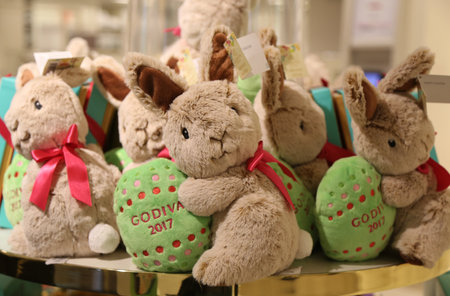 NEW YORK - APRIL 4, 2017: Godiva Chocolatier 2017 Limited Edition Plush Bunny on display in Macy's Herald Square. Godiva Chocolatier is a manufacturer of premium chocolates founded in Belgium in 1926.のeditorial素材