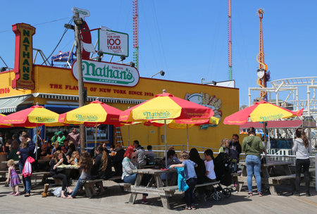 BROOKLYN, NEW YORK - APRIL 13, 2017 : The Nathan's original restaurant at Coney Island boardwalk in Brooklyn. The original Nathan's still exists on the same site that it did in 1916.のeditorial素材