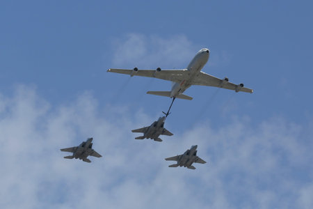 BEER SHEBA, ISRAEL - MAY 2, 2017: Boeing 707 refueling tanker in formation with F-15I all-weather multi role strike fighter during Israel's Annual Independence Day Air Force Flyover in Beer Shebaのeditorial素材