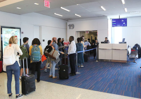 NEW YORK- JUNE 9, 2017: Passengers boarding JetBlue flight to Havana, Cuba at JetBlue Terminal 5 at...