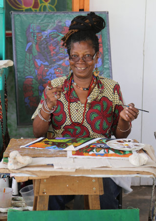 GRAND ANSE, GRENADA - JUNE 10, 2017: Local artist at the Grand Anse Craft and Spice Market in Grenada.のeditorial素材