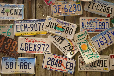 BAR HARBOR, MAINE - JULY 2, 2017: Old car license plates on the wall in Bar Harbor. In the U.S., where each state issues plates, New York State has required plates since 1901のeditorial素材