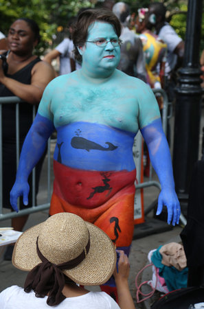 NEW YORK - JULY 22, 2017: Artists paint 100 fully nude models of all shapes and sizes during 4th NYC Body Painting Day featuring artist Andy Golub on Washington Square in New Yorkのeditorial素材