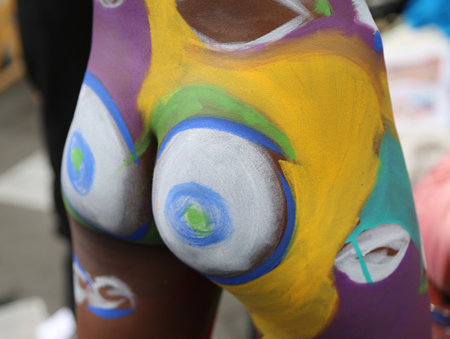 NEW YORK - JULY 22, 2017: Artists paint 100 fully nude models of all shapes and sizes during 4th NYC Body Painting Day featuring artist Andy Golub on Washington Square in New Yorkのeditorial素材