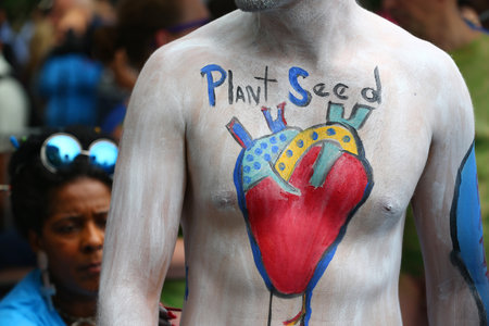 NEW YORK - JULY 22, 2017: Artists paint 100 fully nude models of all shapes and sizes during 4th NYC Body Painting Day featuring artist Andy Golub on Washington Square in New Yorkのeditorial素材