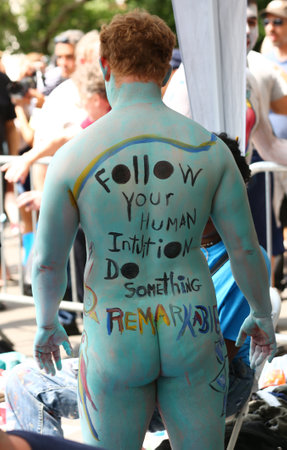 NEW YORK - JULY 22, 2017: Artists paint 100 fully nude models of all shapes and sizes during 4th NYC Body Painting Day featuring artist Andy Golub on Washington Square in New Yorkのeditorial素材