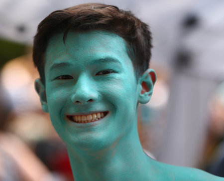 NEW YORK - JULY 22, 2017: Artists paint 100 models of all shapes and sizes during 4th NYC Body Painting Day featuring artist Andy Golub on Washington Square in New Yorkのeditorial素材