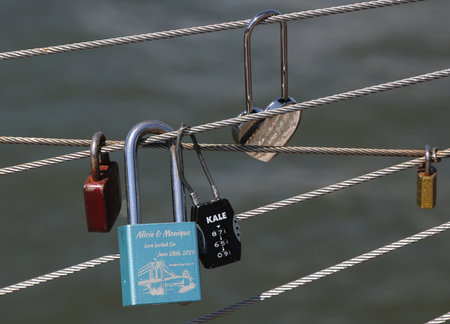 BROOKLYN, NEW YORK - AUGUST 13, 2017: Love locks at the Brooklyn Bridge Park in Brooklyn, New York. Ritual of affixing padlocks, as symbol of love, to bridge is spread in Europe from 2000sのeditorial素材