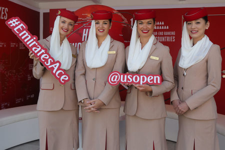 NEW YORK - SEPTEMBER 4, 2017: Emirates Airlines flight attendants at the Emirates Airlines booth at...