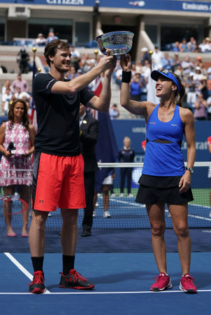 NEW YORK - SEPTEMBER 9, 2017: US Open 2017 mixed doubles champions Jamie Murray of Great Britain and Martina Hingis of Switzerland during trophy presentation at Billie Jean King National Tennis Centerのeditorial素材