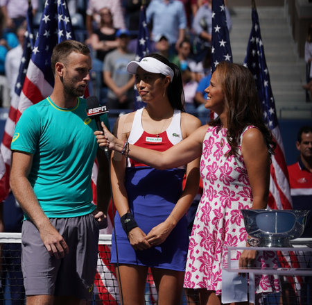 NEW YORK - SEPTEMBER 9, 2017: US Open 2017 mixed doubles finalists Michael Venus of New Zealand and Hao-Ching Chan of Taiwan during trophy presentation at Billie Jean King National Tennis Centerのeditorial素材