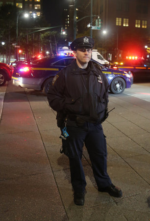 NEW YORK - OCTOBER 31, 2017: NYPD officer at the crime scene near a terror attack site in lower Manhattan in New York.のeditorial素材