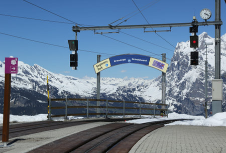 KLEINE SCHEIDEGG, SWITZERLAND - MAY 5, 2017: Kleine Scheidegg railway station situated on the summit of the Kleine Scheidegg Pass in the Bernese Oberland region of Switzerlandl at altitude 6762 Ftのeditorial素材