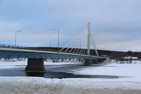 ROVANIEMI, FINLAND - FEBRUARY 17, 2017: The Jatkankynttila bridge or Lumberjacks Candle Bridge over Kemijoki River in Rovaniemi, Finlandのeditorial素材