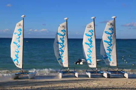 NASSAU, BAHAMAS - DECEMBER 3, 2017: Sandals Hobie Cat catamaran ready for tourists at the Cable Beach at the Sandals Royal Bahamian Luxury Resort in Nassau, Bahamasのeditorial素材