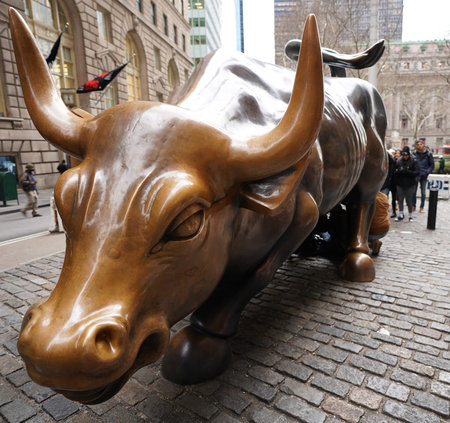 NEW YORK - DECEMBER 12, 2017: The Wall Street Bull in Manhattan. Charging Bull is a bronze sculpture that stands in Bowling Green in the Financial District in Manhattanのeditorial素材