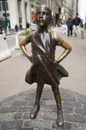 NEW YORK - DECEMBER 12, 2017: The Fearless Girl opposite the Charging Bull in lower Manhattan Manhattan.のeditorial素材