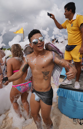 PLAYA DEL CARMEN, MEXICO - DECEMBER 31, 2017: Beach party at Iberostar Paraiso Maya Hotel at Playa Del Carmen in Mexico.のeditorial素材