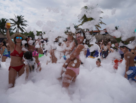 PLAYA DEL CARMEN, MEXICO - DECEMBER 31, 2017: Beach party at Iberostar Paraiso Maya Hotel at Playa Del Carmen in Mexico.のeditorial素材