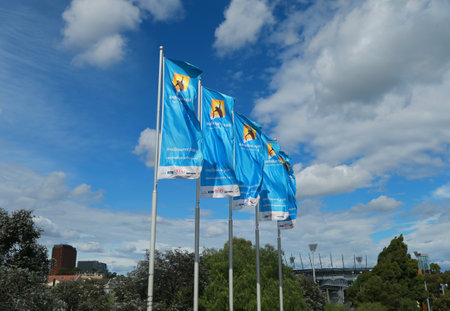 MELBOURNE, AUSTRALIA - JANUARY 31, 2016: Flags with Australian Open logo waving in the wind. The Australian Open is a major tennis tournament held annually in Melbourne, Australiaのeditorial素材