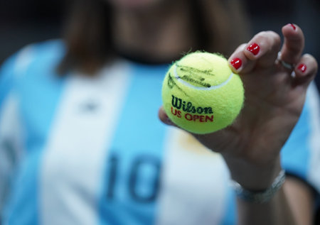 NEW YORK - SEPTEMBER 6, 2017: Argentinian tennis fan holds tennis ball with Grand Slam champion Juan Martin Del Porto autograph after his US Open 2017 quarterfinal match against Roger Federer at Arthur Ashe Stadiumのeditorial素材