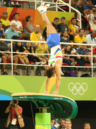 RIO DE JANEIRO, BRAZIL - AUGUST 15, 2016: Artistic gymnast Marian Dragulescu competes at the Men's Vault Final on artistic gymnastics competition at Rio 2016 Olympicsのeditorial素材