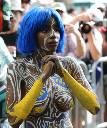 NEW YORK - JULY 14, 2018: Artists paint  fully nude models of all shapes and sizes during 5th NYC Body Painting Day featuring artist Andy Golub on Washington Square in New Yorkのeditorial素材