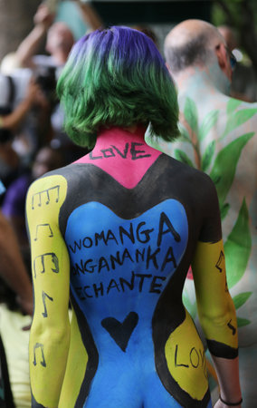 NEW YORK - JULY 14, 2018: Artists paint  fully nude models of all shapes and sizes during 5th NYC Body Painting Day featuring artist Andy Golub on Washington Square in New Yorkのeditorial素材