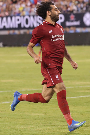 EAST RUTHERFORD, NJ - JULY 25, 2018: Mohammed Salah #11 of Liverpool FC in action against Manchester City during 2018 International Champions Cup game at MetLife stadium.のeditorial素材