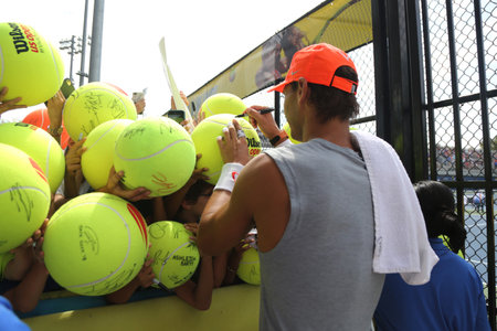 NEW YORK - SEPTEMBER 1, 2018:17-time Grand Slam Champion Rafael Nadal of Spain signs autographs after practice for 2018 US Open at Billie Jean King National Tennis Center in New Yorkのeditorial素材