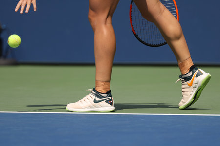 NEW YORK - AUGUST 27, 2018: Grand Slam Champion  Simona Halep of Romania wears custom Nike tennis shoes during her 2018 US Open first round match at Billie Jean King National Tennis Center in New Yorkのeditorial素材