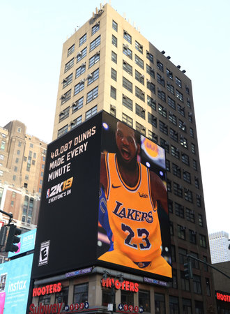NEW YORK - DECEMBER 6, 2018: Billboard promoting video games with LeBron James and The Entertainment Software Rating Board in Manhattanのeditorial素材