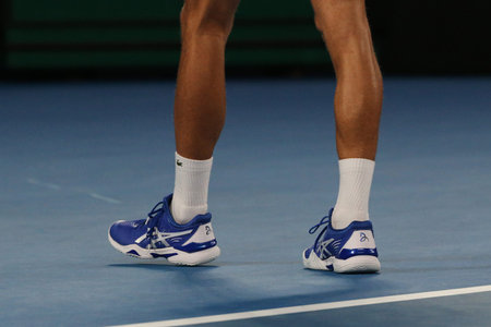 MELBOURNE, AUSTRALIA - JANUARY 27, 2019: Grand Slam champion  Novak Djokovic of Serbia wears custom Asis tennis shoes during his final match at 2019 Australian Open in Melbourne Parkのeditorial素材