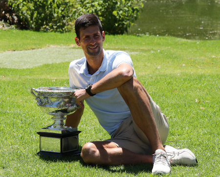 MELBOURNE, AUSTRALIA - JANUARY 28, 2019: 2019 Australian Open champion Novak Djokovic of Serbia posing with Australian Open trophy after his victory at Royal Botanic Gardens Victoria in Melbourneのeditorial素材