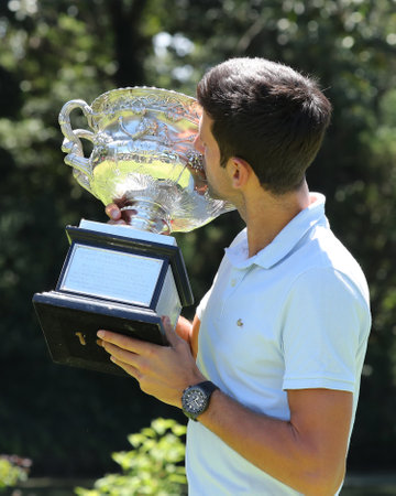 MELBOURNE, AUSTRALIA - JANUARY 28, 2019: 2019 Australian Open champion Novak Djokovic of Serbia posing with Australian Open trophy after his victory at Royal Botanic Gardens Victoria in Melbourneのeditorial素材