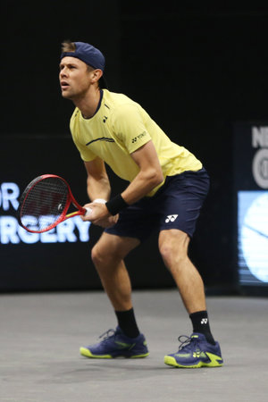 UNIONDALE, NEW YORK - FEBRUARY 14, 2019: Professional tennis player Radu Albot of Moldova in action during his round of 16 match at the 2019 New York Open tennis tournament in Uniondale, New Yorkのeditorial素材