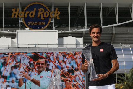 MIAMI GARDENS, FLORIDA - MARCH 31, 2019: Grand Slam champion Roger Federer of Switzerland posing with trophy after his win at 2019 Miami Open final match at the Hard Rock Stadium in Miami Gardens, FLのeditorial素材
