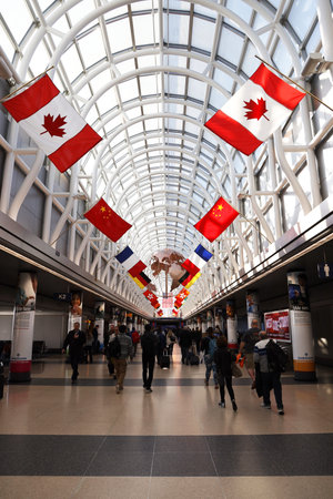 CHICAGO, ILLINOIS - MARCH 12, 2019: Grand Concourse decorated with international flags at O'Hare International Airport in Chicagoのeditorial素材