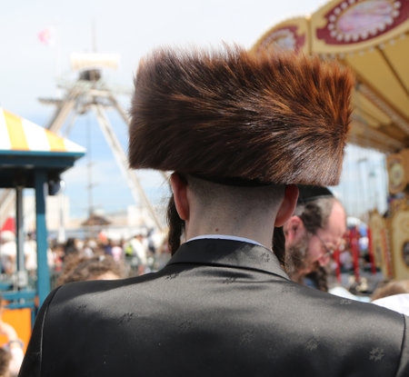 BROOKLYN, NEW YORK - APRIL 23, 2019: Jewish orthodox family enjoy outdoors during Passover at Coney Island Luna Park  in Brooklyn, New Yorkのeditorial素材