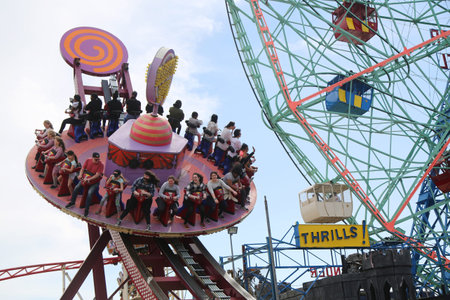 BROOKLYN, NEW YORK, APRIL 23, 2019: Electro Spin ride at Coney Island Luna Park. Coney Island Luna...