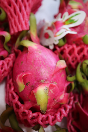 Juicy Dragon fruit at market stallの写真素材