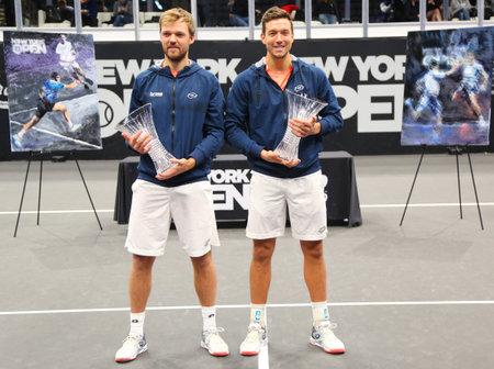 UNIONDALE, NEW YORK - FEBRUARY 17, 2019: 2019 New York Open doubles champions Kevin Krawietz (L) and Andreas Mies of Germany during trophy presentation after final match in Uniondale, New Yorkのeditorial素材