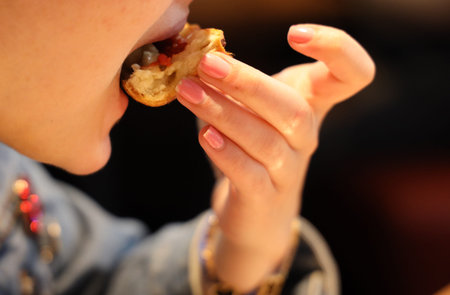 Woman eating Chicago Style Deep Dish Cheese Pizza
