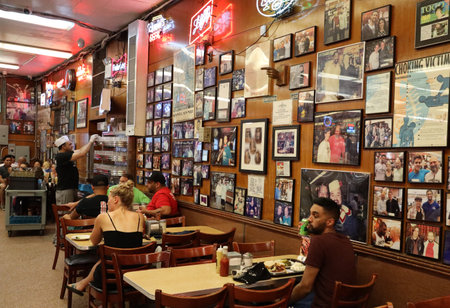 NEW YORK - JULY 30, 2019: Historical Katz's Delicatessen full of tourists and locals. Since its founding in 1888, it has become popular among locals and tourists for its pastrami sandwichesのeditorial素材