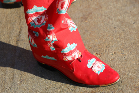 NEW YORK - JULY 24, 2019: Liverpool fan wears shoes with team logo before the 2019 Western Union Cup game Liverpool FC against Sporting CP at Yankee stadium in New Yorkのeditorial素材