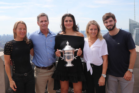 NEW YORK - SEPTEMBER 8, 2019: 2019 US Open champion  Bianca Andreescu of Canada poses with US Open trophy with her team on the Top of the Rock Observation Deck at Rockefeller Centerのeditorial素材