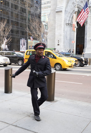 NEW YORK - DECEMBER 5, 2019: Salvation Army soldier performs for collections in midtown Manhattan during holidays season. This Christian organization is known for its charity work, operating in 126 countriesのeditorial素材