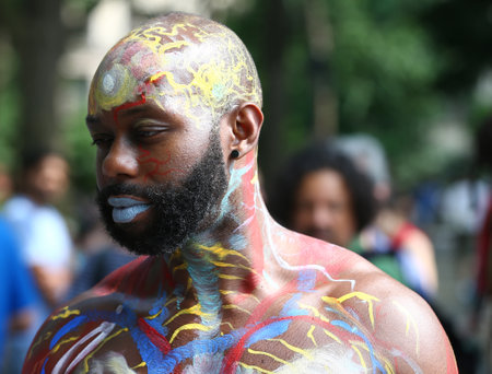 NEW YORK - JULY 22, 2017: Artists paint 100 fully nude models of all shapes and sizes during 4th NYC Body Painting Day featuring artist Andy Golub on Washington Square in New Yorkのeditorial素材