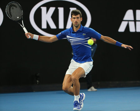 MELBOURNE, AUSTRALIA - JANUARY 27, 2019: 14 time Grand Slam Champion Novak Djokovic of Serbia in action during his final match against Rafael Nadal at 2019 Australian Open in Melbourne Parkのeditorial素材